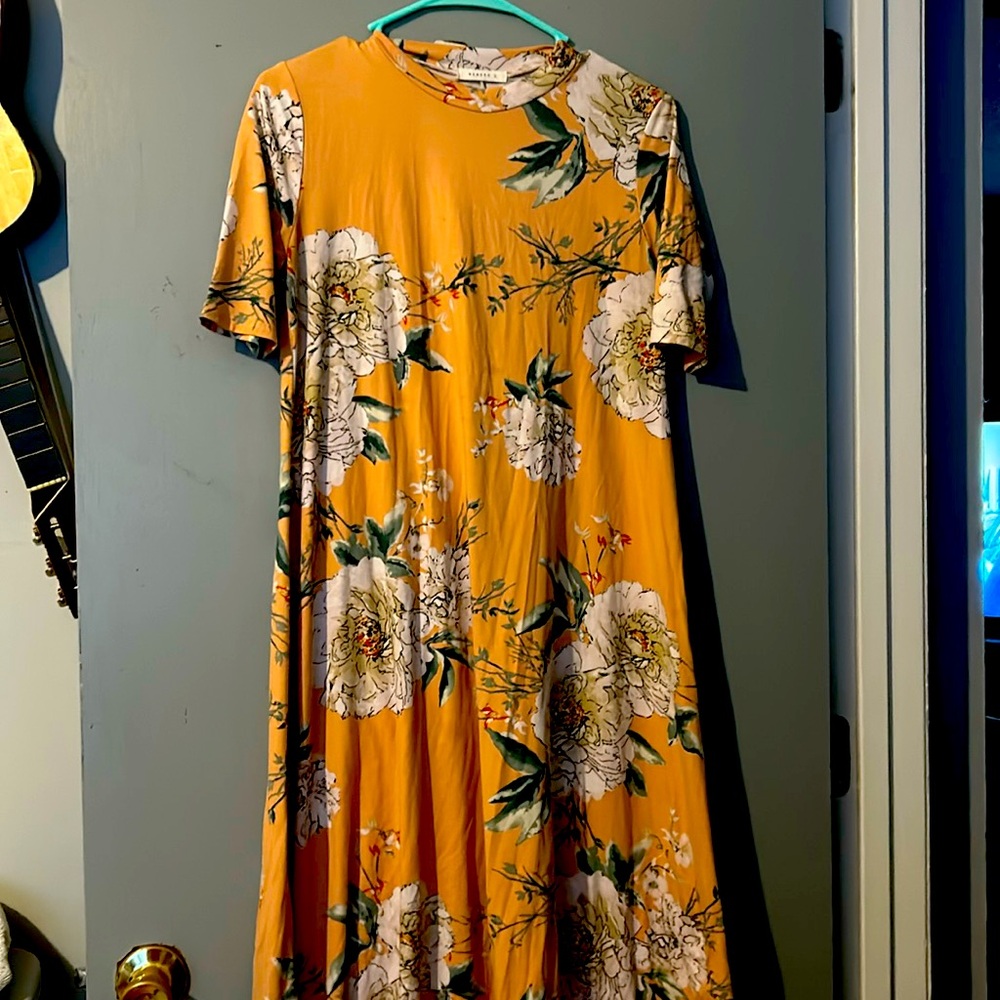 Ladies, long maxi dress, short sleeve peachy orange color with flowers, a medium
